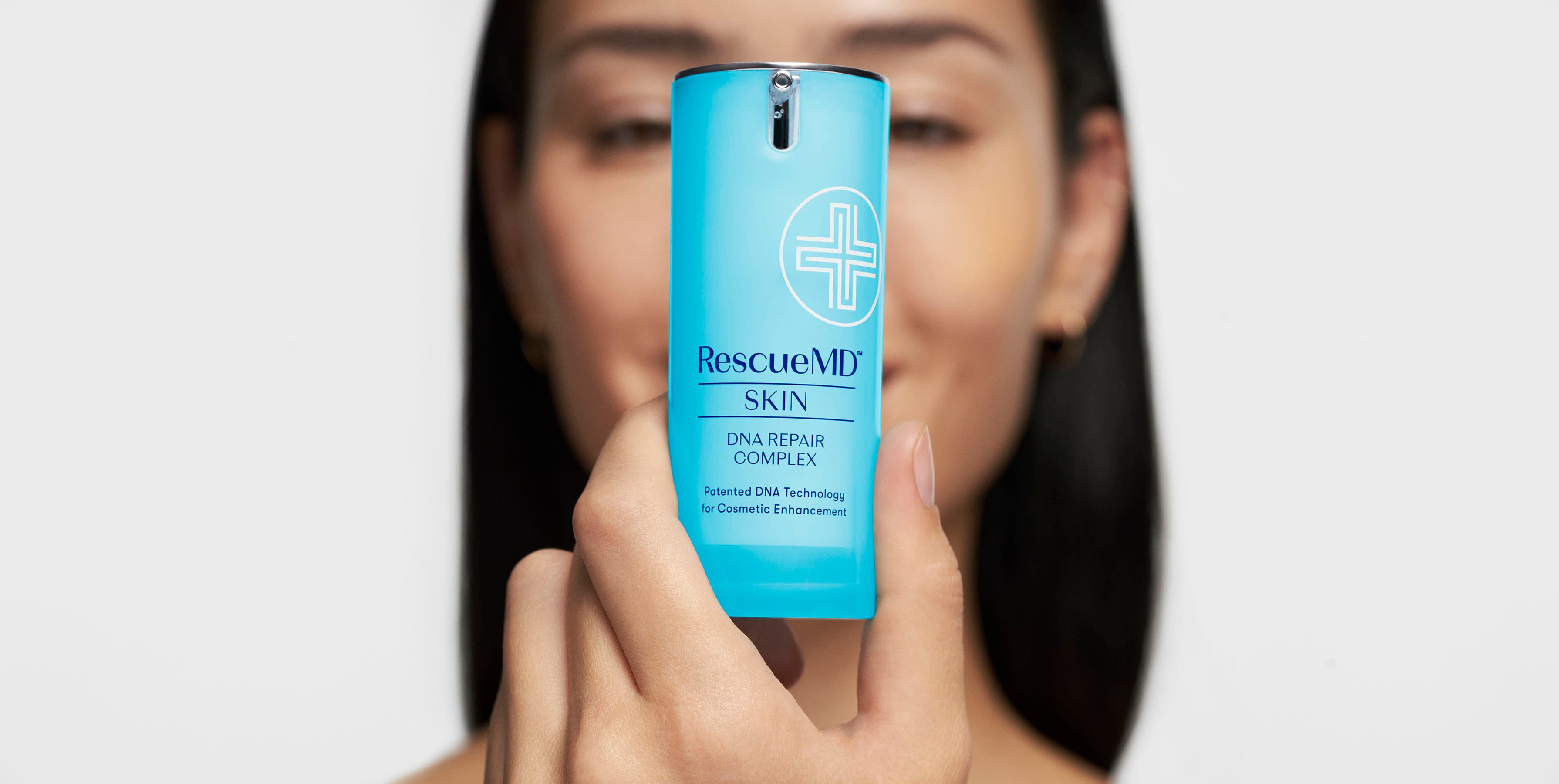 Model holding RescueMD DNA Repair Complex serum bottle